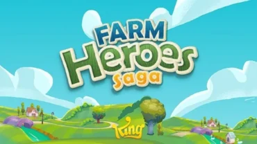 A person holding a phone displaying the Farm Heroes Saga game.